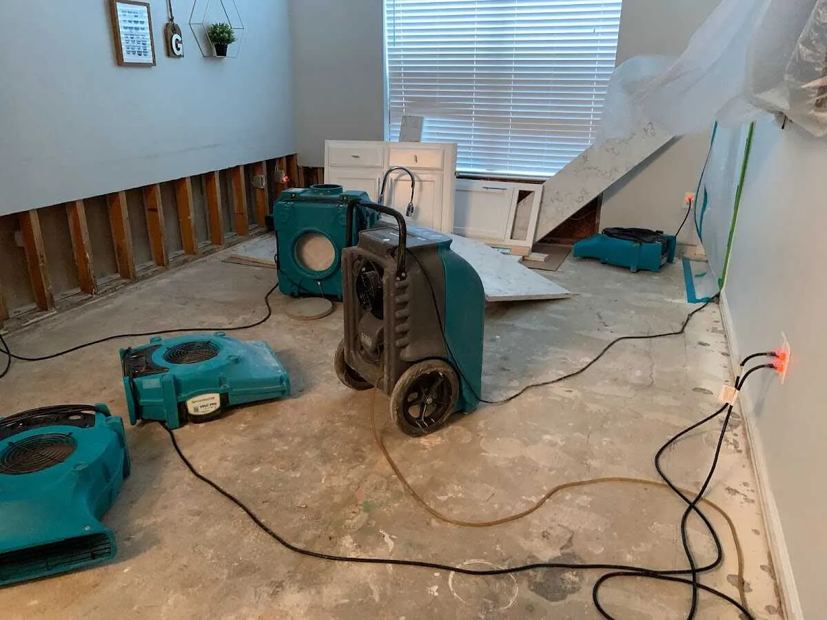 Dehumidifier in flood-cut room for Water Damage Restoration in Clovis